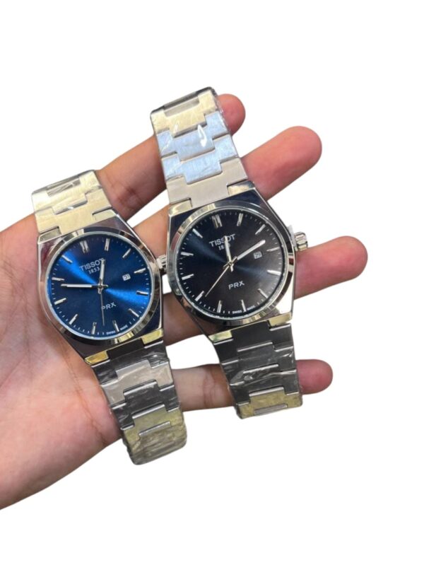 ساعات Tissot PRX Quartz الأصلية تصميم أيقوني بلمسة عصرية متوفرة باللون الأزرق والأبيض والأسود - Image 3
