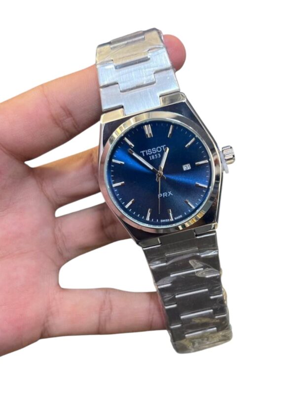 ساعات Tissot PRX Quartz الأصلية تصميم أيقوني بلمسة عصرية متوفرة باللون الأزرق والأبيض والأسود - Image 7